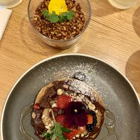 Almond & rice pancakes with a strawberry vanilla cashew cream and puffed almond and buckwheat granola   at Le Potager de Charlotte in Paris