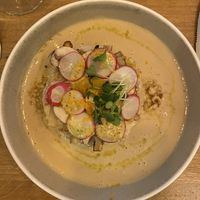 Hazelnut mashed potatoes with white asparagus, orange whole grain mustard vinaigrette and rooibos and tamari cream and radish   at Le Potager de Charlotte in Paris