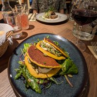 Chickpea pancakes and tofu in the background at Le Potager de Charlotte in Paris