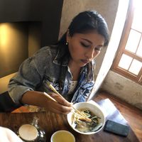 Practicing with chopsticks   at El Buda Profano in Arequipa