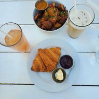 Croissant and Crispy Potatoes with Iced Coffee and Watermelon Lychee Juice at Little Pine in Los Angeles