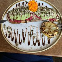Sliced Avo on toast - a creatively presented Vegan option   at The Glass Den in Coburg