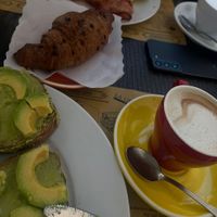 Avocado toast without egg, vegan chocolate croissant and oat milk latte   at La Licata in Rome