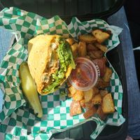 Veggie chicken tender wrap and fried potatoes. I ate the other half 😂 but it comes with both. at Dancing Avocado in Daytona Beach