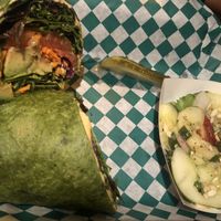 Avo hummus wrap with side cucumber salad at Dancing Avocado in Daytona Beach