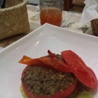 delicious tomato stuffed with lentils on a bed of guacamole  at Narciso Vegano in Mexico City