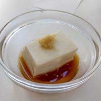The cold tofu (I already ate half of it). 
Surprisingly very nice. Tofu has a nice texture and  goes well with the dash of ginger on top of it. But it's the soy sauce that makes this dish so wonderful - it has a delightful yuzu (citrus) flavor. at Momi Cafe in Kyoto