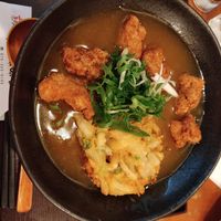 Vegetarian curry udon with soy nuggets and tempura at Mimikou in Kyoto