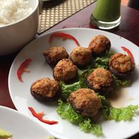 mushrooms with tofu on top at San May Vegetarian in Hue