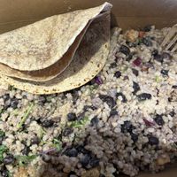 Burrito bowl special with cashew queso 🌱🤍  at Naked Lunch in Herndon