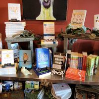 WFPB library with books for sale - took me a decade to get most of these books!!! at GreenFare Organic Cafe in Herndon