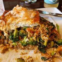 half eaten organic fried quinoa with baked tofu and vegetables. at GreenFare Organic Cafe in Herndon