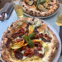 Flower blossom pozza (front) and vegearth (back)  at Pizzeria Dope in Amsterdam