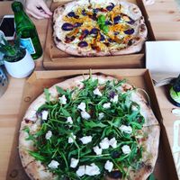 Pizzas we shared, one with vegan brie (Sweet Earth) and  the other with sweet potatoes and zucchini blossoms (Flower Blossom). at Pizzeria Dope in Amsterdam