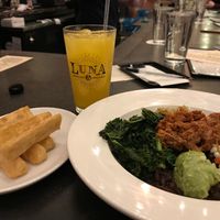 Yuca fries, jackfruit grain bowl, and mango agua fresca at Luna Rotisserie & Empanadas in Durham