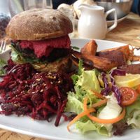 Burger plus sweet potato chips and salad. at Urban Zen in Swansea