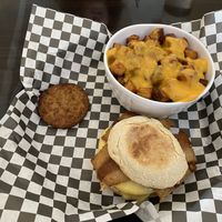 Freakin McMuffin with Sausage, egg, cheese and extra patty, because...why not?! (Plant based) at Clovermint Cafe and Market in Dania Beach