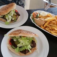 Seitan burgers and large fries with peanut sauce and mayonnaise at Vegs in Halle