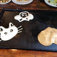 Vegan pancakes cooking on the griddle table at Backwater in Melbourne