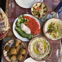 Falafel, salad, hommus and moutabal.   at Abo Shariha in Doha