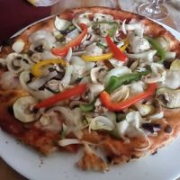 Vegan pizza with vegan mozzarella at Pizzeria Jolly in Schoenau Am Konigssee