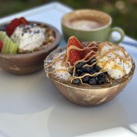 Mango and Açaí Bowl, almond milk flat white   at Bohemian Raw Cafe in Whitsunday
