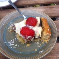 I couldn't resist several bites before taking a bite of the exquisite Danish traditional cake - jordbærtærte med mazarinbund! at Kaf in Copenhagen