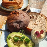Blueberry volcano and sourdough bun with avocado at Kaf in Copenhagen