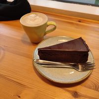 Triple chocolate cheesecake and oat flat white at Kaf in Copenhagen