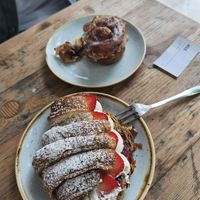 Croissant with strawberries and cream, cinnamon bun at Kaf in Copenhagen