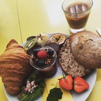 Sourdough, butter, jam, nutella, cheese, chia pudding with granola, passionfruit, kiwi, strawberries, avocado and croissant 😍 at Kaf in Copenhagen