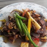 Beet steak and vegan crab cakes at The Nomad Cafe in Melbourne