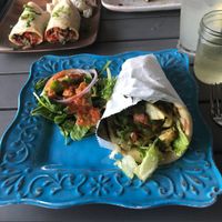 Tikka Wrap: hummus, grilled veggies, herb aioli on a house-made pita at The Nomad Cafe in Melbourne