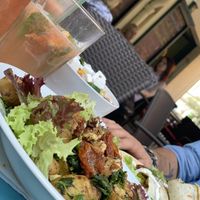 Vegan baked potatoes, greek salat and tortilla with tempeh  at Blatouch in Prague