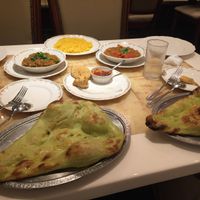 veggie pakoras (half eaten... hehe), chana masala, baingan bharta, turmeric rice, and vegan naan!  at Milan Nataraj in Tokyo