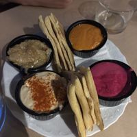 4 dips plate with pita breadd  at Baba Ghanoush Falafel Shop in Athens