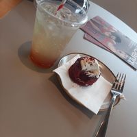 Vegan cake and iced peach tea. at Phoenix Cafe Bar in Leicester