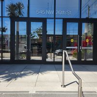 If you walk in this way, you have to walk through these doors and the staff at the front desk will direct you to how to get to the restaurant at Love Life Cafe in Miami