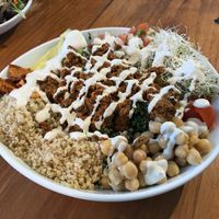 Taco salad (kale salad, lentil walnut "meat", organic quinoa, garbanzo beans, cherry tomatoes, alfalfa sprouts, pico de gallo, avocado, tortilla chips, cashew cream, lemon dressing at Love Life Cafe in Miami