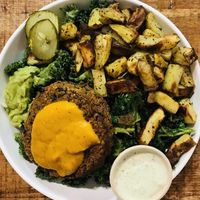 Veggie burger, kale, golden potatoes  at Love Life Cafe in Miami