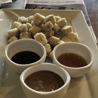 Crispy tofu with soy sauce, vinaigrette and peanut sauce for dipping at Mint & Basil in Milpitas
