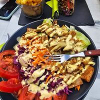 Chicken poke bowl and seitan gyro wrap at Veggiezz - Am Salzgriess in Vienna