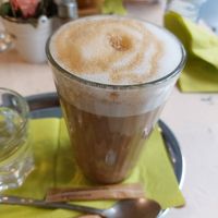 Latte machiato with oat milk at Veggiezz - Am Salzgriess in Vienna