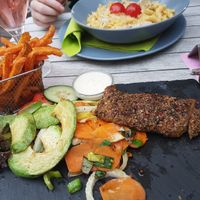 The steak with avocado, veg and sweet potato fries. The carbonara in back. at Veggiezz - Am Salzgriess in Vienna