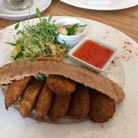 Falafel pita, served with small, fresh salad, houmous and sweet chilli sauce. at The Veggie Cafe in Ilkley