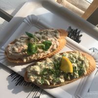 "fishy" and Pochoutkovy (classic option - potato, mayo, soft salami) sandwiches   at Chlebíček Store in Prague