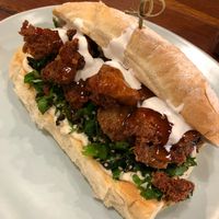 ‘Chicken’ burger w tabouli, hommus, sweet chilli, sour cream  at Bliss & Chips in Newtown