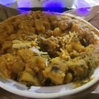 Large Plate(pick 3 over rice)w/ alu masala, soy protein curry, and squash at Punjabi Grocery & Deli in New York City