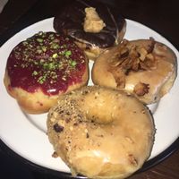 Top clockwise: Choc peanut fudge, maple smoked coconut, salted caramel hazelnut & blueberry pistachio   at Brammibal's Donuts - Maybachufer in Berlin