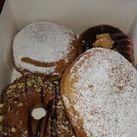 Donuts. One with chocolate and peanutbutter fudge, one with nougat and two filled with dulce de leche (weekly special). at Brammibal's Donuts - Maybachufer in Berlin
